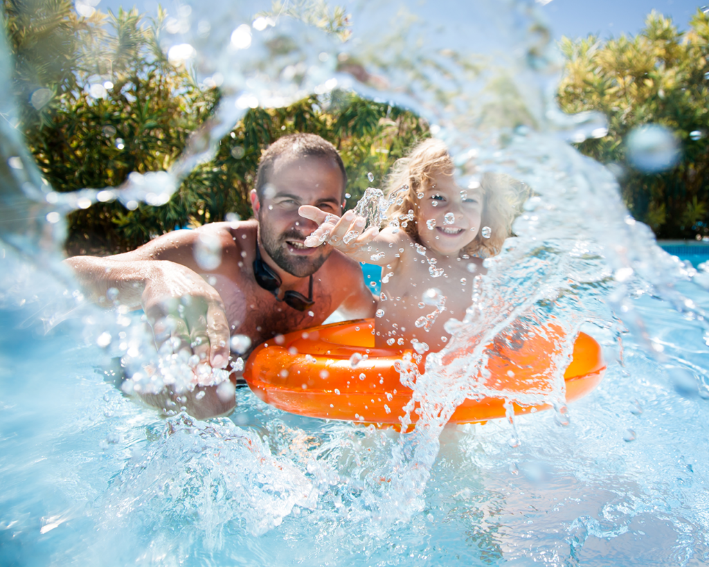 Fiberglass pool cost installation process, showing professional installation in a residential backyard