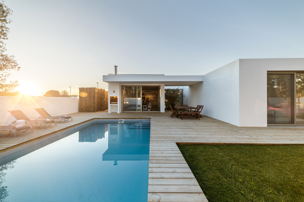 Modern fiberglass pool near me with lighting and water features